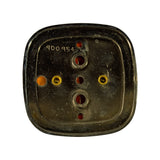 Rear (back) face of lamp. Two bayonet bulb holders visible (upper and lower positions). Two brass threaded mounting studs visible. Mould code '900954' stamped/moulded into the rear housing. Minor surface dust consistent with long-term storage.