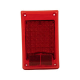 Front face of lamp module showing large LED array with red lens covering upper three-quarters and red retro-reflector section in lower quarter; moulded text 'LED Multivolt by Hella' and 'Made in New Zealand' visible at top