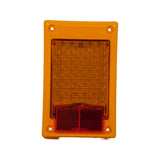 Front face of module in vertical orientation. 'LED Multivolt by Hella / Made in New Zealand' moulded text visible on amber surround. LED array occupies upper two-thirds; red retroreflector at lower portion. ECE approval marking visible near bottom. Four corner mounting holes clearly shown.