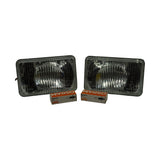 Both headlamp inserts laid flat, front lens face up, alongside two Osram Halogen H1 bulb boxes. Lenses are clear glass with ribbed/fluted optic pattern; 'BOSCH' cast into the lens; E1 type-approval marks and '27.5' visible on each lens.