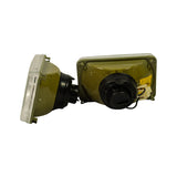 Both headlamps photographed from the rear, showing olive-green painted metal housings, black bulb caps, and wiring harnesses. Mounting tabs visible at corners of each housing.