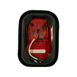 Rear/back face of lamp unit; red plastic housing with circuit board and wiring visible; sticker reads '10-30V S/T LAMP'; 'MODEL 45-LED' moulded into rear housing; wiring exits from centre; spade connector set visible at bottom