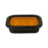 Three-quarter isometric view from front-right showing depth of lamp and grommet assembly; amber lens face and black grommet profile both visible; 'MODEL 45700' readable on grommet side.