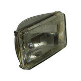 Front three-quarter view of the sealed beam unit from driver's-right angle. Same ribbed lens profile, 'WAGNER' embossing lower-centre, corner mounting tabs visible. Overall appearance confirms unmarked, unused lens with no chips, cracks, or discolouration.