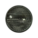 Front face of lamp alone, straight-on view showing full circular lens with dense horizontal ribbed flood-pattern optics and central GE logo medallion embossed on glass.