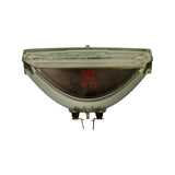 Rear face of lamp, straight-on. Stamped in red: '12V50W / 4651 / JAPAN'. Circular ECE-style approval mark and an additional small circle mark (possibly quality stamp) visible. Two brass spade terminal lugs protruding from base. Reflector housing is polished bare metal.