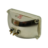 Three-quarter rear view showing lamp from corner. Both spade lug terminals visible. Stamped markings '12V50W / 4651 / JAPAN' legible on reflector rear. Minor surface tarnish on metal reflector housing.