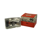 Part out of original Stanley red-and-white 'Sealed Beam' retail box; box face reads 'STANLEY Sealed Beam' with car silhouette graphic and 'STANLEY ELECTRIC CO.,LTD. MADE IN JAPAN'; white label on box top shows part number '4651' and additional spec text.