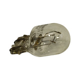 Bulb on its side, plastic-free wedge base visible at left, glass envelope showing the two coiled filaments and side stamp