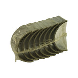 Three-quarter angle of the sealed sleeve showing the curved profile of the shells and faint stampings visible on the outer backs through the plastic