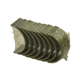 Close three-quarter view highlighting the silver bearing faces, locating tabs, and oil-hole drillings on the shell backs