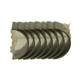 Flat side-on view of the bearing set laid in a row inside shrink wrap, showing the curved shells nested together and the tri-metal bearing surface