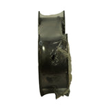 End-on view of the sealed bearing pack showing stacked shell profile and the oil hole pierced through one half-shell