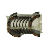 Underside of the blister pack showing the shells nested in pairs with the flanged thrust-bearing halves visible at the outer ends