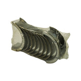 Opposite side view showing the bearing backs and edges; the flanged thrust bearing sits at one end of the stack, all shells still sealed in original plastic