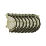 Top-down view of eight tri-metal bearing half-shells stacked in clear shrink wrap, oil groove and oil hole visible on upper shells