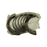 Angled view of bearing set in sleeve showing flanged thrust shells at both ends and plain main shells in between