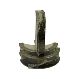 Two thrust-flanged bearing shells shown from the flange side, displaying the serrated thrust faces that control crankshaft end-float