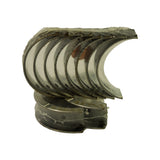 End-on view of the stacked shrink-wrapped shell set, showing the bearing-side faces and a faint STD size marking visible on one of the lower thrust shells