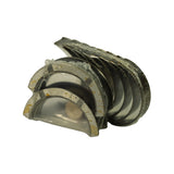 Reverse-side view showing the steel backs of two shells at the front, with light tan adhesive or preservative residue visible on the backing