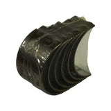 Reverse side of the bundle with steel backs facing out; 'STD' size stampings and partial part numbers visible on the bearing backs through the shrinkwrap