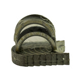 Other side of the bearing set, showing 0.75 oversize marking stamped on the backs of the shell halves along the edge of the stack