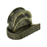 Three-quarter angle view showing the layered structure of the set, yellowed shrink-wrap adhesive visible, pairs of shells stacked