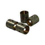 Three bushes in a pyramid stack showing length profile end-on and side-on. Polished bronze bore contrasts with the raw steel outer face. Oil hole alignment visible.