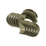 Loose fan-spread arrangement of all half-shells out of the wrap, showing bi-metal running surfaces, locating tangs and the thrust-flanged pair at rear
