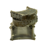 Stacked view showing the full set — plain main shells on top, flanged thrust bearing on bottom — all still sealed in factory heat-shrink plastic