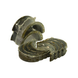 Angled layout of the complete five-pair main bearing set with thrust bearing in foreground, plain shells fanned behind; sealed plastic wrap intact across all pieces