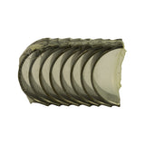 Top-down view of the bearing stack, eight half-shells side by side revealing the curved outer steel backs and crescent inner running surfaces
