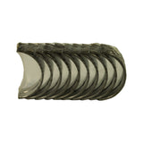 Full set of bearing shells fanned face-on showing polished aluminium-alloy bearing surface across all shells. Minor age oxidation visible on steel backs at top edge; bearing surfaces appear clean and uninstalled.