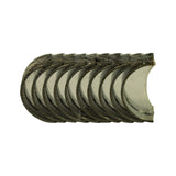 Alternate face-on fan view of the same bearing shells, showing the semi-circular form and slight relief at the parting line. Oil hole visible on at least one shell.