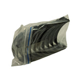 Angled view of sealed bag with bearing shells stacked, showing the dark glossy overlay coating on the bearing surfaces