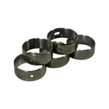 Five cam bearings clustered at an angle, with oil holes and slots of different positions visible, confirming this is a matched indexed set rather than identical parts.