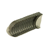 Three-quarter angled view of the stack showing crimped end seal of the plastic sleeve and the curved bearing face of the shells
