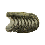 Stacked bearing shells in heat-shrunk plastic wrap viewed end-on, showing curved cross-section and crescent profile of each half-shell