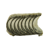 Sealed stack laid horizontally, eight plain half-shells clearly visible with grey steel backs and tri-metal overlay surfaces