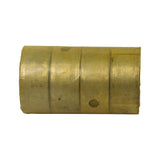 Close-up top view of two bearing shells showing the oil hole perforation on one shell and the smooth white-metal bearing surface interior.