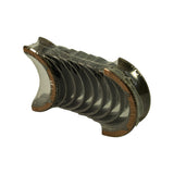 Reverse three-quarter angle of the same wrapped bearing set, steel backs visible on the outer shells and flanges at both ends
