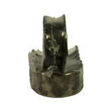 End-on close-up of stacked wrapped bearing shells, slightly out of focus, showing bearing profile and thrust flange