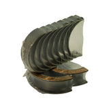 Angled view showing oil-feed holes drilled through the upper shells and the solid lower shells, thrust flange pair visible below