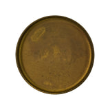 Reverse (concave/open cup) face of the same brass plug, showing the recessed interior and pressed rolled rim around the perimeter. No additional markings visible on this face.