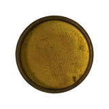 Reverse (inner) face of the plug showing the shallow recessed cup profile and raised outer rim/flange; surface has patchy tarnish and light scuffing; no part numbers or markings visible.