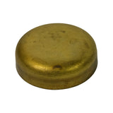Three-quarter view from opposite angle showing convex dome and flanged sealing edge; consistent brass finish with age spotting on dome surface; no part number visible on exterior