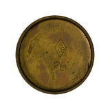 Reverse (concave) face of plug showing stamped diamond-shaped PP manufacturer logo and stamped size marking '2 1/16"', with shallow recessed rim around circumference