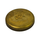 Three-quarter angled view of convex (outer/domed) face showing smooth brass dome profile and rim, same GM and size markings partially visible at angle