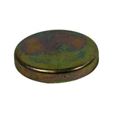 Three-quarter angled view of convex face showing dome height and rim profile; rust blush and zinc-chromate finish deterioration evident across the dome surface