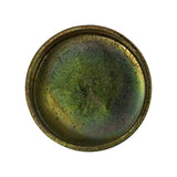 Flat top-down view of concave face showing recessed seating rim around full circumference; heavy zinc-chromate deterioration with dark green oxidation and rust blush throughout